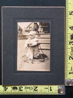 Antique Photo Card of Cute Baby Wearing Hat in Walker  