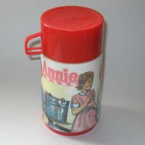 Up for auction is charming Annie metal lunchbox and matching thermos 