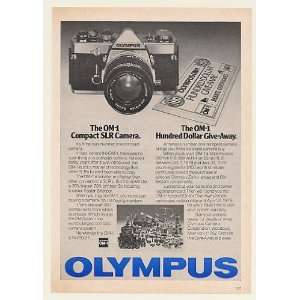   OM 1 Compact SLR Camera $100 Give Away Print Ad (Memorabilia) (50550