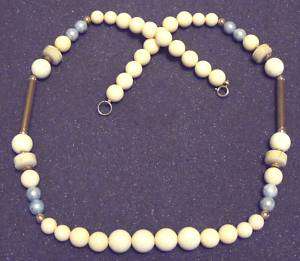 Long plastic bead necklace, off white color  